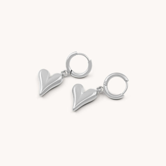 30E3139 - Celine Heart Huggie Hoops, Silver